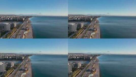 航拍沿海城市和海岸上的公路高清在线视频素材下载