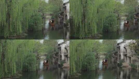古镇中的小河里小船缓缓滑过高清在线视频素材下载