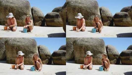 姐妹在海滩上玩沙子高清在线视频素材下载