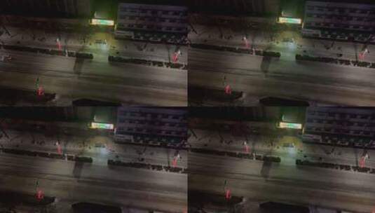 俯瞰深夜街头结冰路面缓慢行车高清在线视频素材下载