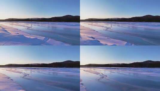 夕阳下内蒙古北方不冻河平静水面雪雾袅袅高清在线视频素材下载