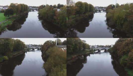 航拍被树木环绕的河流高清在线视频素材下载