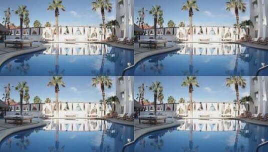 度假酒店的房屋倒映在游泳池里高清在线视频素材下载
