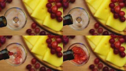 把红酒和奶酪点心倒在桌上高清在线视频素材下载