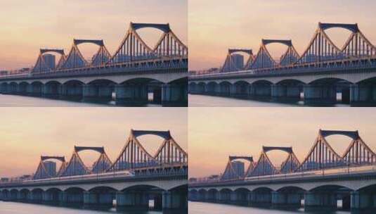 黄昏高铁驶过杭州钱塘江上钱江二桥航拍高清在线视频素材下载