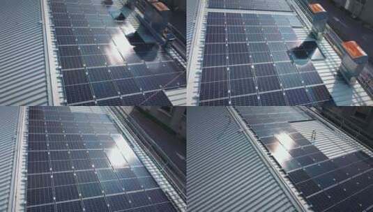 太阳能板在工业建筑顶部的太阳反射高清在线视频素材下载