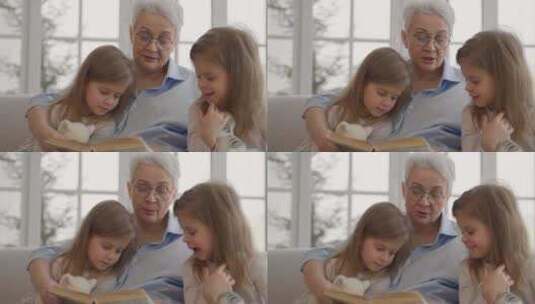 奶奶与孙女休息严重放松老年奶奶拥抱阅读书高清在线视频素材下载