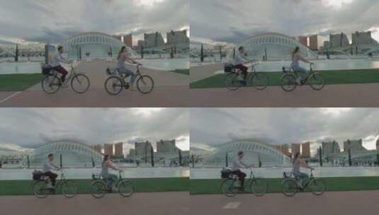 男人和女人在自行车道上骑自行车高清在线视频素材下载