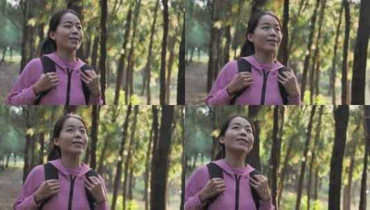 亚洲中国人女性森林树林旅游拿望远镜看风景高清在线视频素材下载