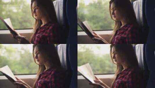 在火车上看书的女孩高清在线视频素材下载