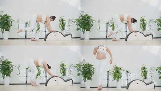 怀孕的美女在健身房锻炼身体做瑜伽动作高清在线视频素材下载