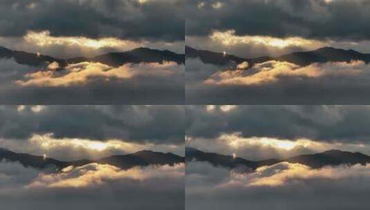 太阳从云缝中照出来，打红了山间的云雾高清在线视频素材下载