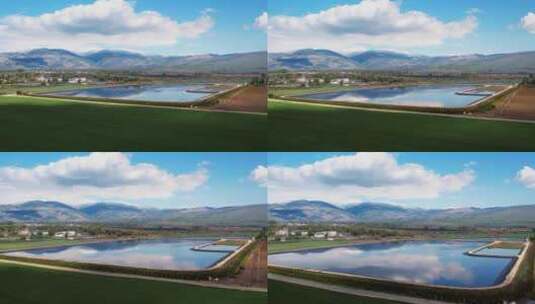 蓝天下的山川湖泊和农田高清在线视频素材下载