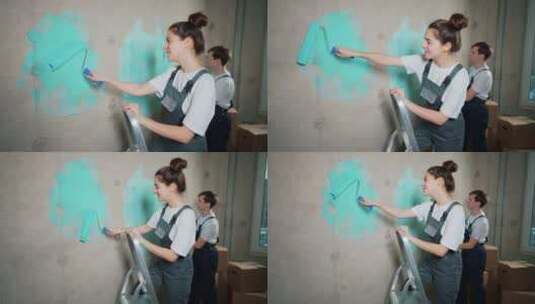 两个人用油漆刷墙高清在线视频素材下载