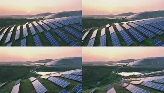 夕阳下山坡上的太阳能光伏发电站航拍高清在线视频素材下载