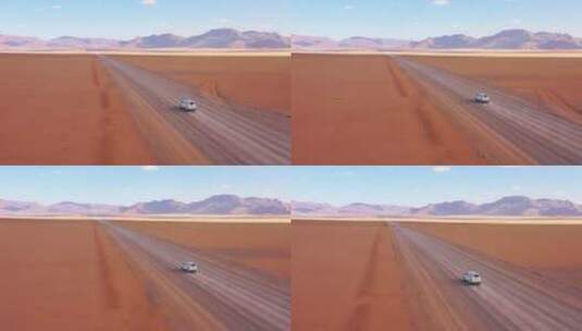 行驶在纳米比亚沙漠公路上的汽车高清在线视频素材下载