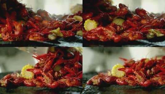 煮熟的小龙虾饭倒在桌子上高清在线视频素材下载
