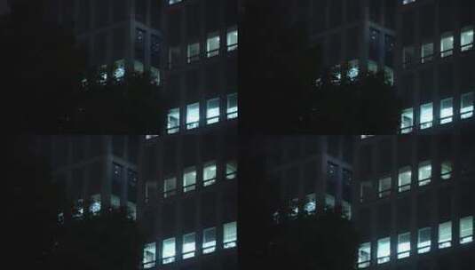 航拍夜晚现代办公大楼的办公室高清在线视频素材下载