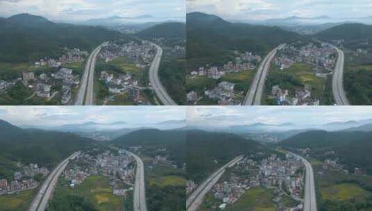 穿过粗村庄的两条公路视频群山云海乡镇高清在线视频素材下载