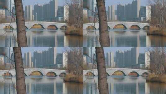 市中心公园人工湖和石拱桥高清在线视频素材下载