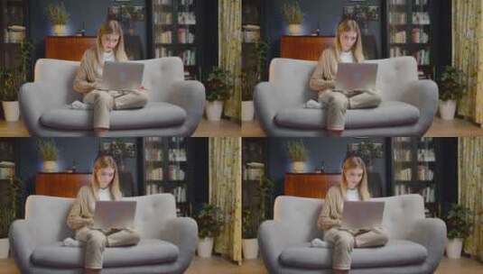 女人坐在沙发上玩电脑高清在线视频素材下载