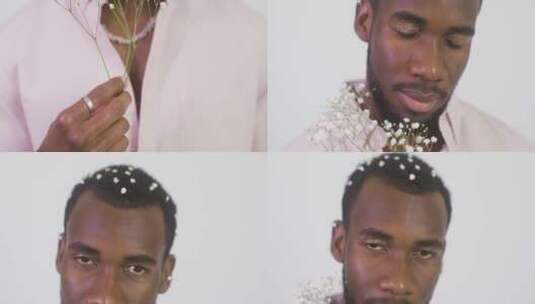 男模特拿着鲜花摆姿势拍摄高清在线视频素材下载