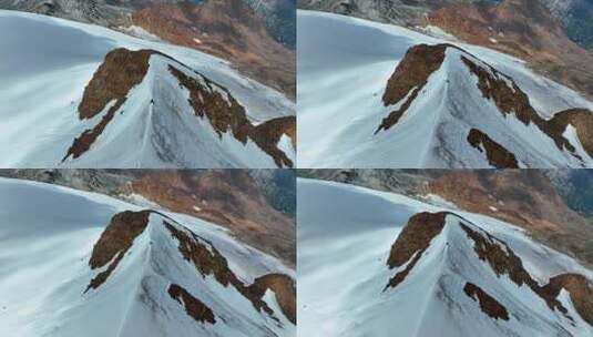 航拍攀登沙鲁里山脉尼登贡嘎雪山的登山者高清在线视频素材下载