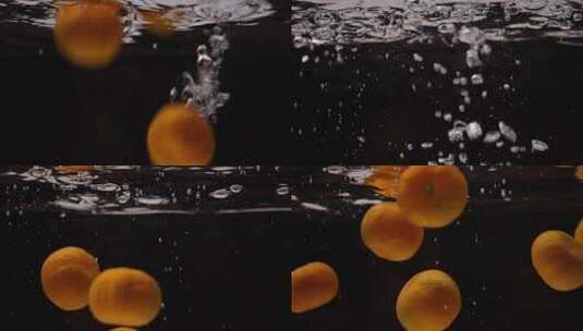 南瓜橘子落水特写高清在线视频素材下载