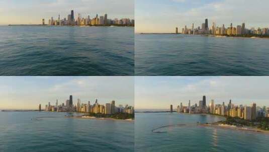 密歇根湖夏季日出时，空中攀登揭示广阔的芝加哥天际线高清在线视频素材下载