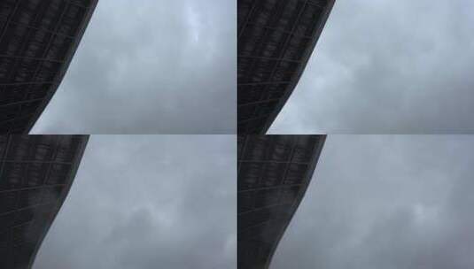 仰拍武汉高铁站大楼外景 天空走云 乌云密布高清在线视频素材下载