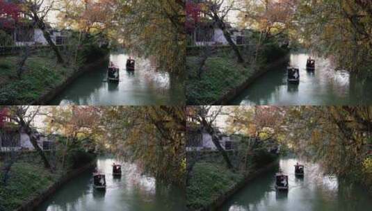 秋天手摇船在河道中前行高清在线视频素材下载