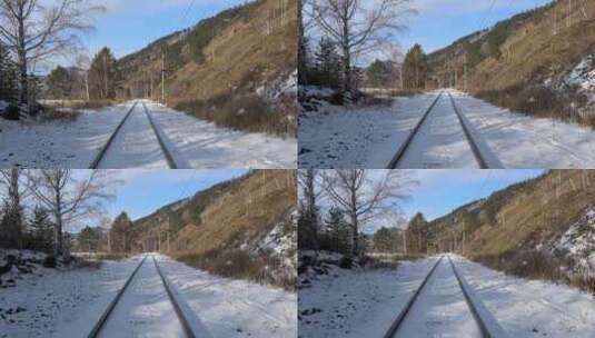 铁路轨道上的雪地上有许多脚印，环贝加尔铁高清在线视频素材下载