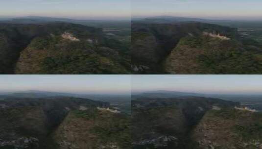 山顶美丽的老虎洞庙的无人机视频高清在线视频素材下载