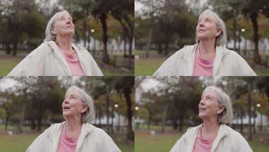 资深女性，在公园思考和户外呼吸大自然的新高清在线视频素材下载
