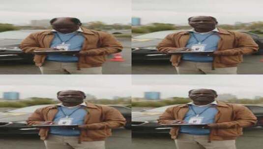 非洲裔美国人驾驶蔻驰在汽车附近摆姿势的肖高清在线视频素材下载
