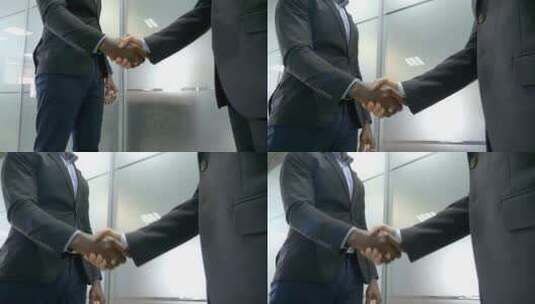两个人在办公室握手高清在线视频素材下载