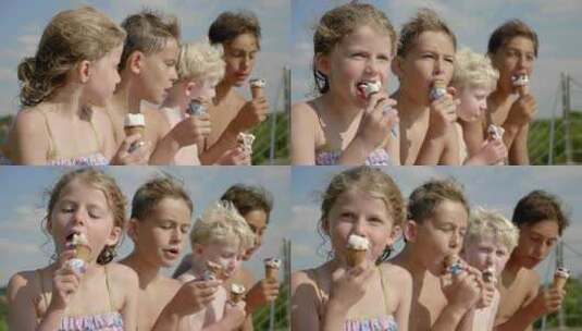 孩子们坐在微风和阳光下舔着冰淇淋甜筒高清在线视频素材下载
