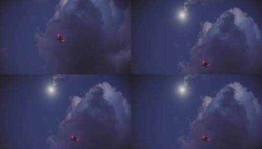 无人机在晚上多云的天空下飞行高清在线视频素材下载