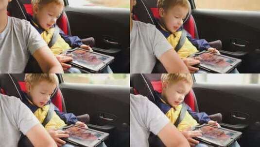 小男孩在车上玩平板高清在线视频素材下载