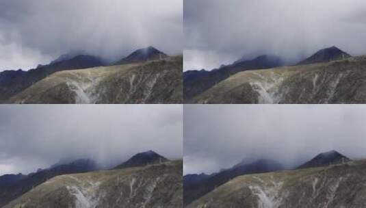 西藏雪山草甸下雨云团延时高清在线视频素材下载