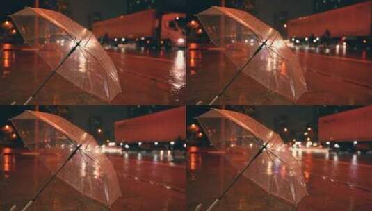 雨夜街道路灯下的透明雨伞4k视频素材高清在线视频素材下载
