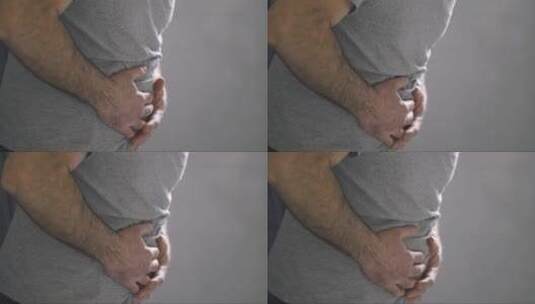 男人摸肚子感觉腹痛高清在线视频素材下载
