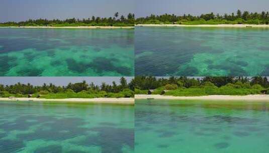 海浪附近清澈的大海和沙滩背景的海岸海滩时间的白天景观高清在线视频素材下载