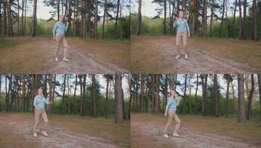 一个女人在松林的空地上跳着凉爽的舞蹈，玩高清在线视频素材下载