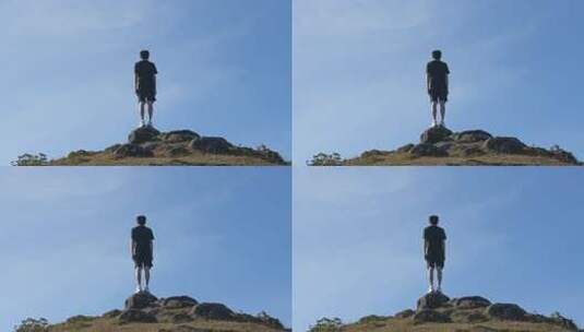 男子立于山顶眺望远方高清在线视频素材下载