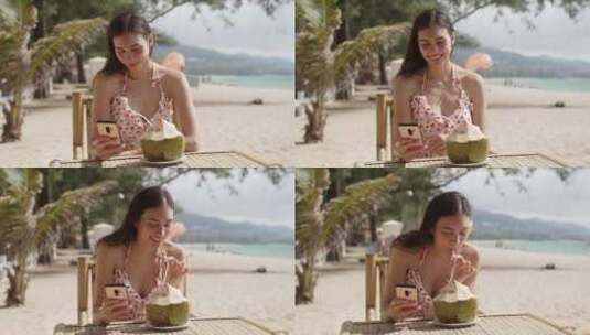 女人在海滩上喝椰子汁高清在线视频素材下载
