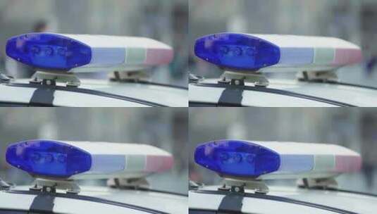 巡逻车车顶上闪烁的警用闪光器高清在线视频素材下载