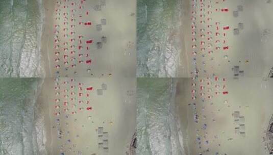 航拍摆着很多遮阳伞的海滩高清在线视频素材下载