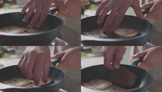 厨师用手翻动锅里的肉片高清在线视频素材下载