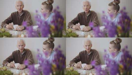 和祖父喝茶聊天的女人高清在线视频素材下载
